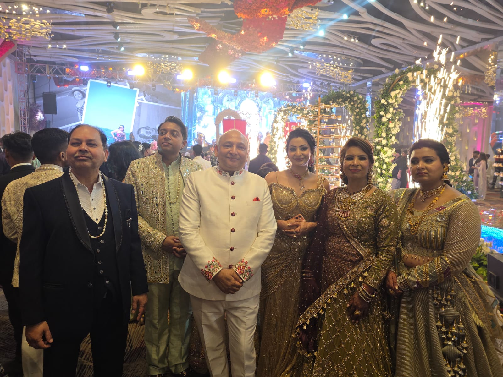Manoj Garg with members of a family at a wedding celebration