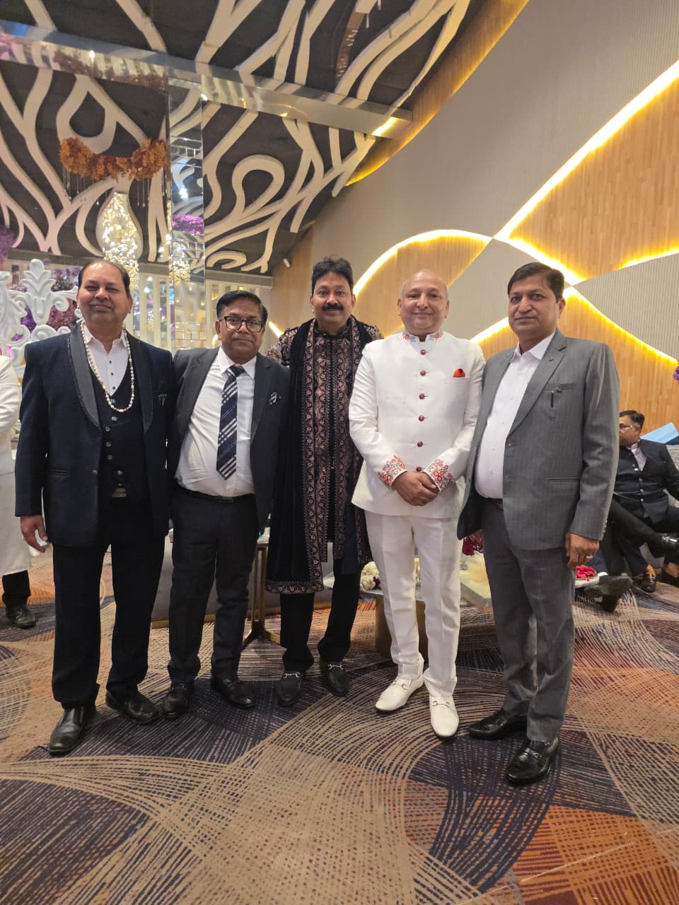 Manoj Garg with members of a family at a formal celebration