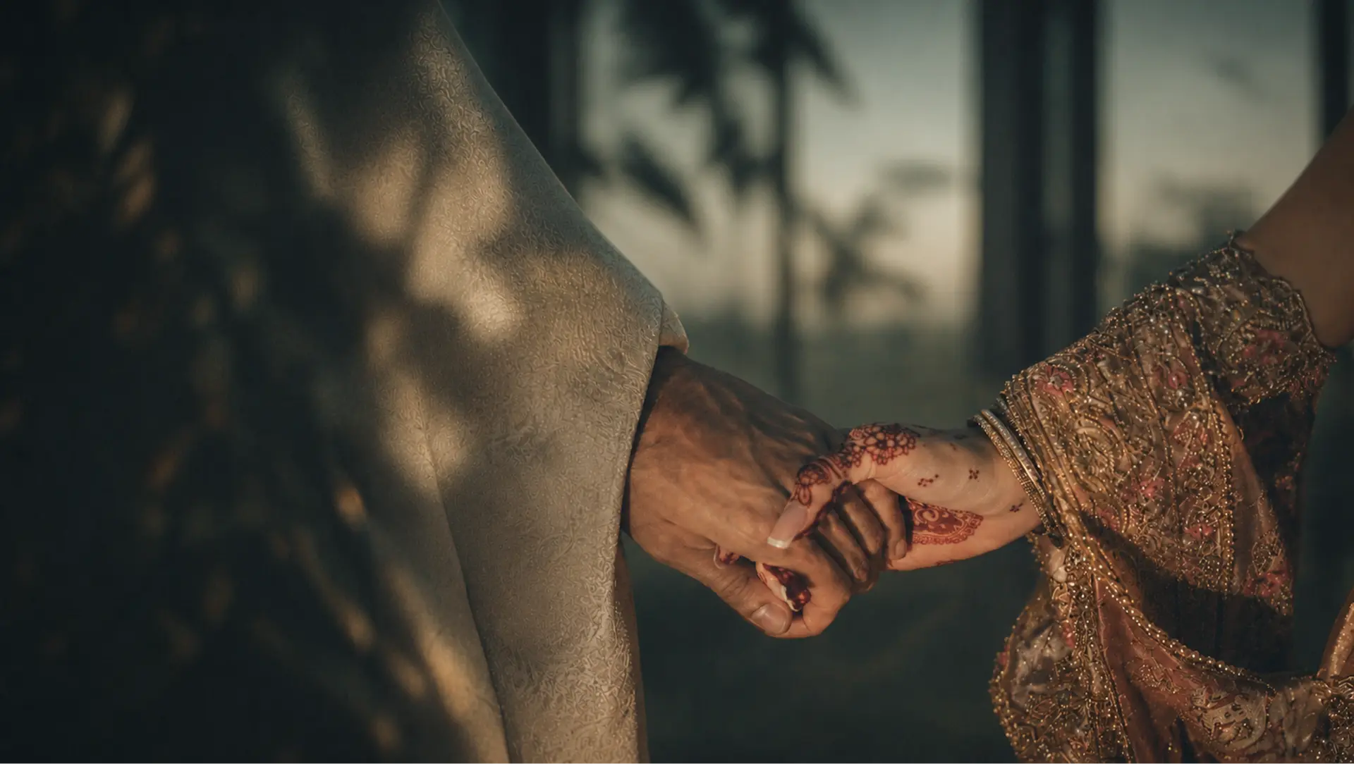 A bride and groom holding hands