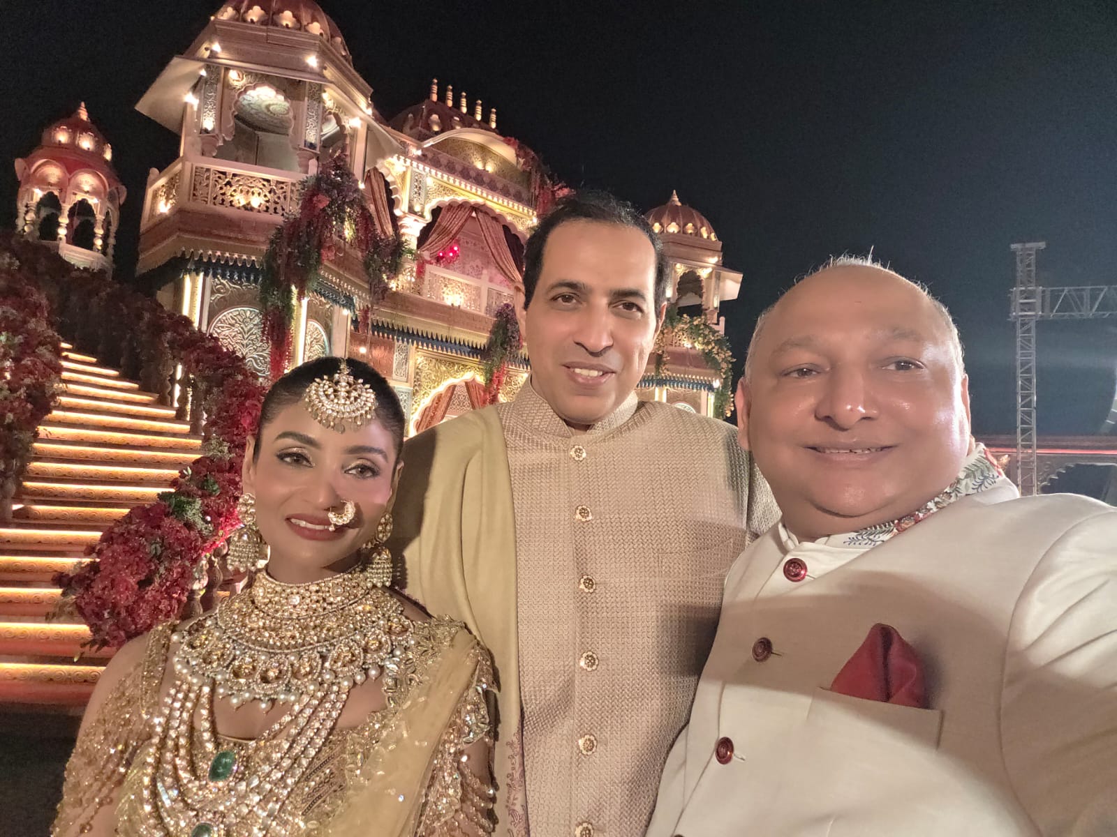Manoj Garg with a bride and family member at a wedding