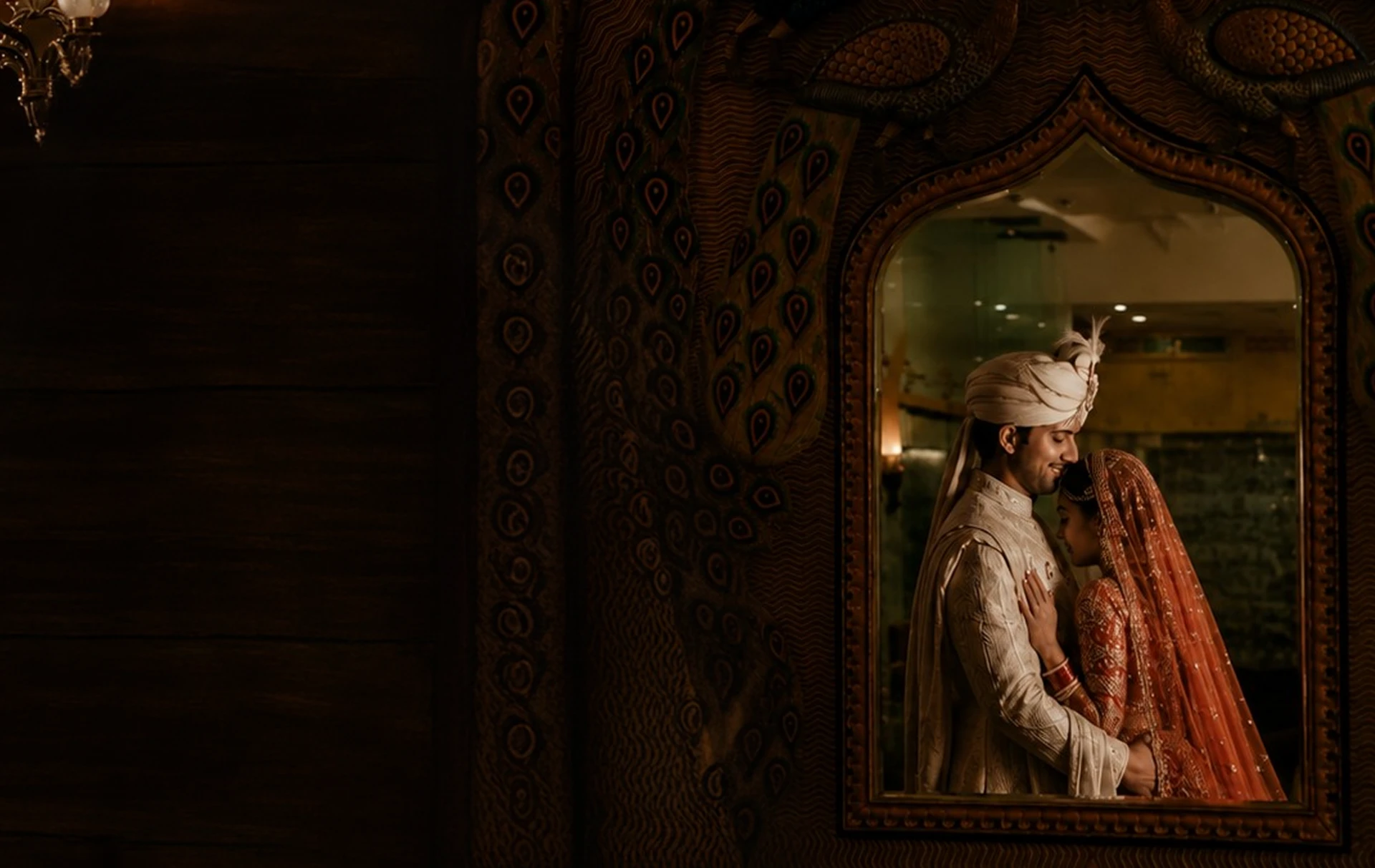 A newly married couple reflected in an ornate mirror